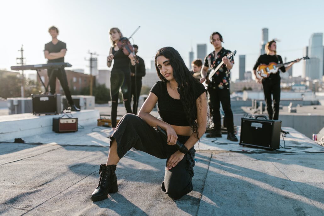 A vocalist crouching on the floor
