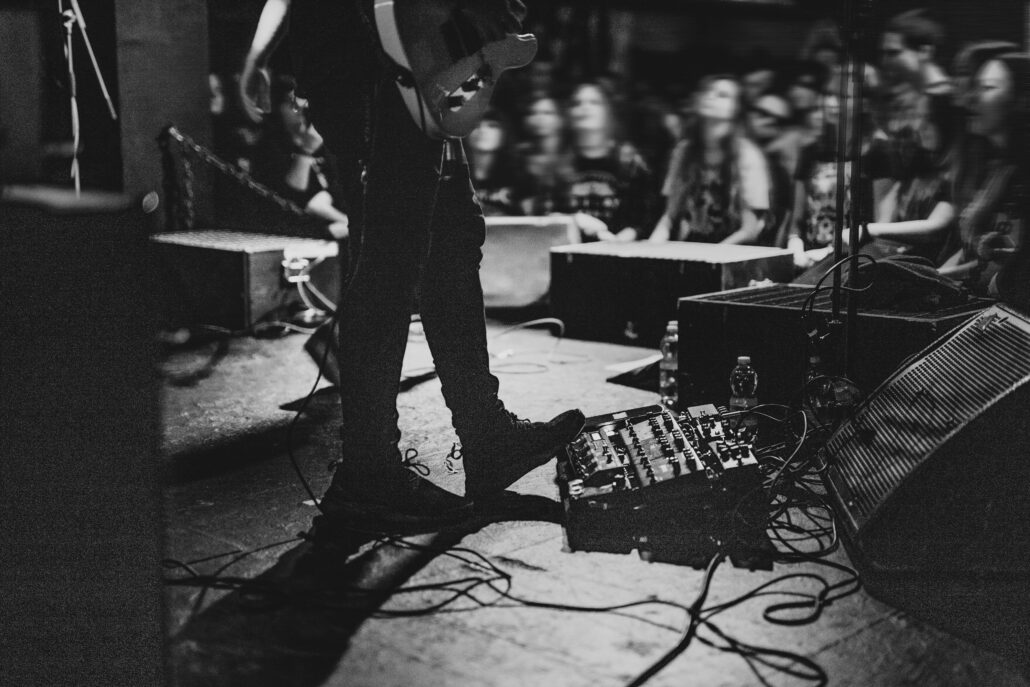 musician using a pedal board in a concert 2022 12 15 23 35 04 utc